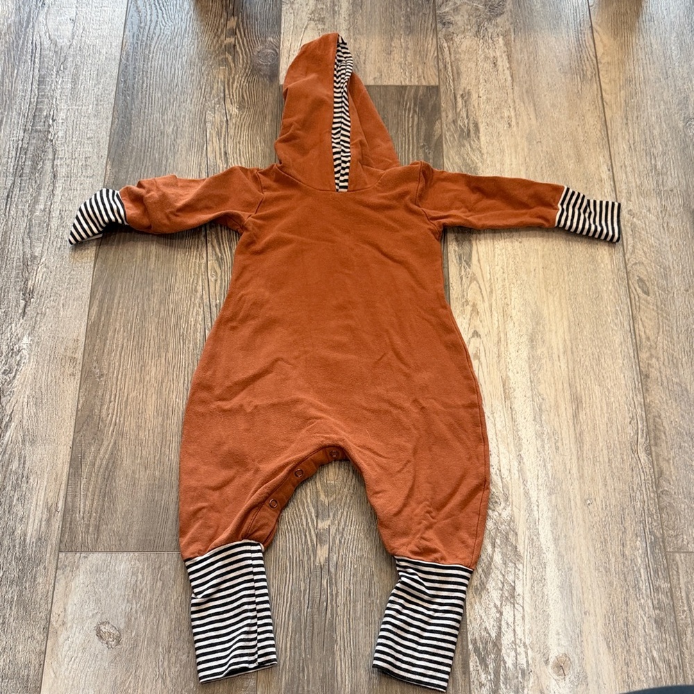 Caribou Rust Hooded Baby One-Piece with Black & White Stripe Trim